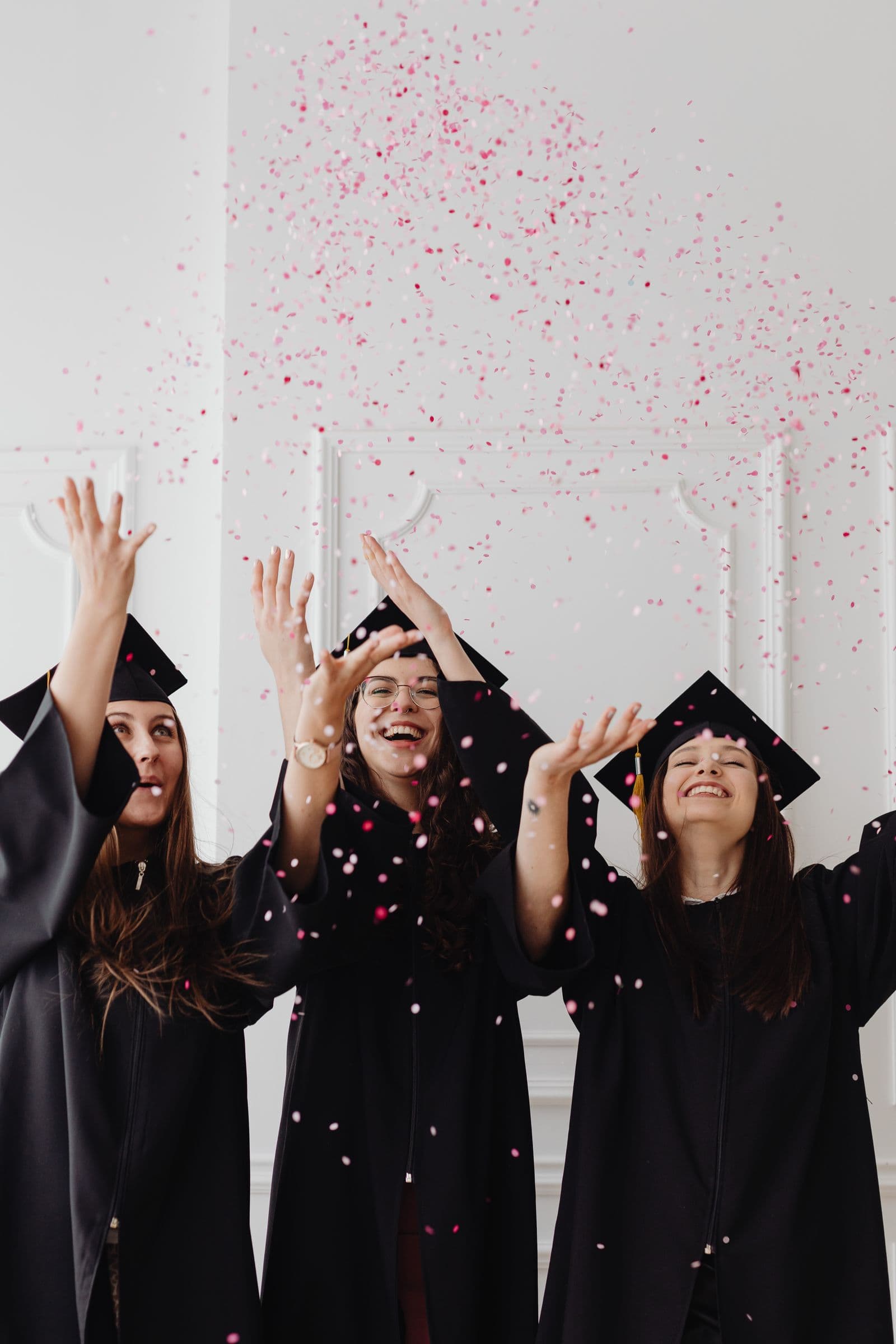 Graduates celebrating their academic achievement in caps and gowns