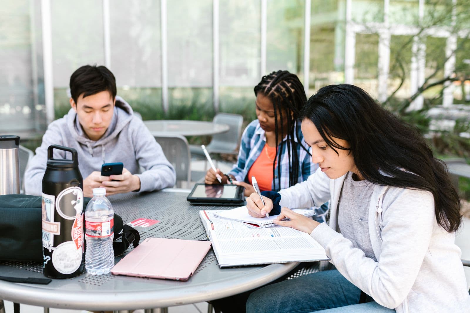 Group of students studying together collaboratively around a table